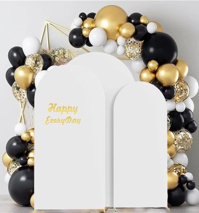 Elegant black, white, and gold balloon arch with happy message board.