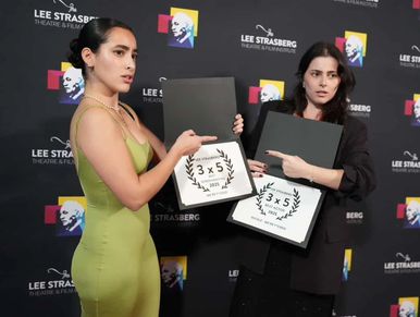 Two women proudly display certificates at the Lee Strasberg Theatre &amp; Film Institute event.