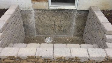 Custom Retaining Wall Stone Window Well Mid-Project