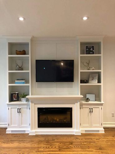 Custom made fire place with bookcase ends 