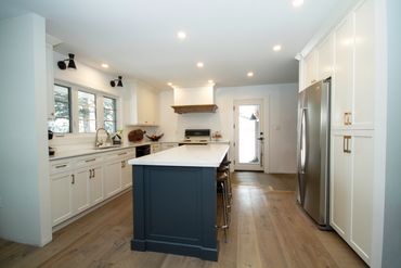 custom two tone kitchen with reclaimed hood range vent 