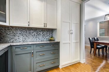 Custom two tone kitchen in shaker style pantry 