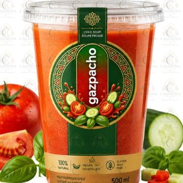 Container of gazpacho cold soup with fresh ingredients.