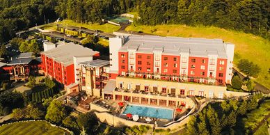 A large mountain resort surrounded by green scenery. 