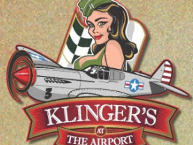 Klinger's logo:colorful  painting of WWII women and plane.