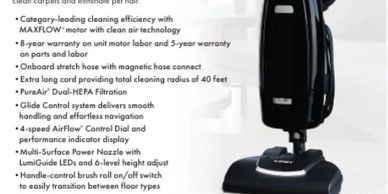 Black vacuum cleaner with detailed features and warranty info.