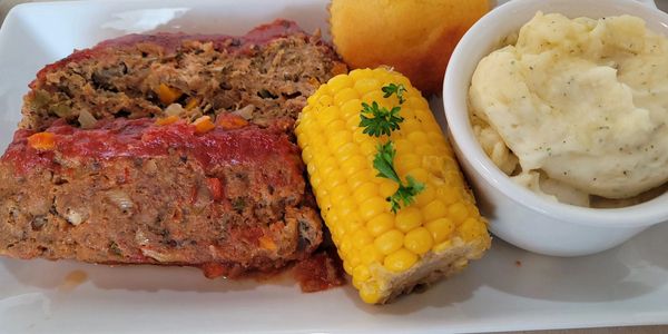 Ground Turkey Meatloaf with Mashed Potatoes, Corn on the Cobb and Buttermilk Cornbread Muffin.