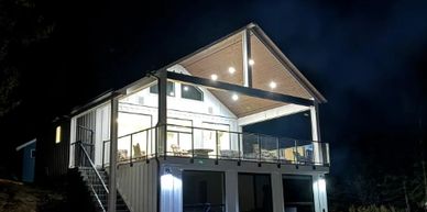 Open concept kitchen and living room. Bedroom on main floor with 4 single bunk beds, upstairs offers