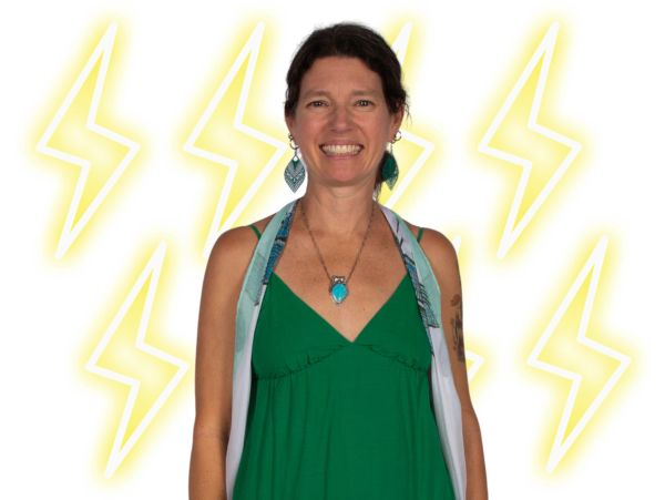 Smiling woman in green dress with lightning bolt graphics behind her.