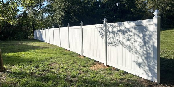 Completed vinyl privacy fence for a homeowner in Union CT.