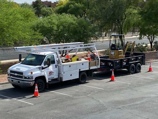 Picture of a truck that is carrying work equipment 