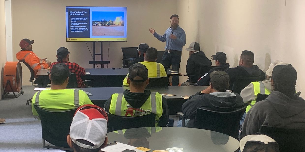 Person teaching a group of people safety certifications 