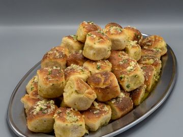 garlic knots on a silver tray