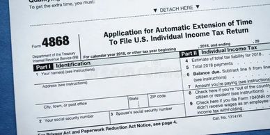 A close-up of a U.S. tax form 4868 for automatic extension of filing time.