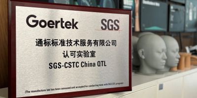 Goertek SGS certification plaque in a lab.