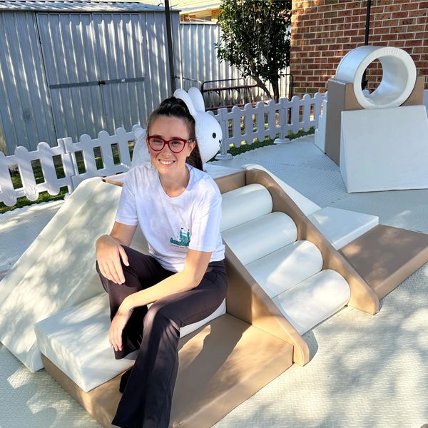 Bambolinis Soft Play Founder, Sandy Manfredi sitting on soft play equipment.