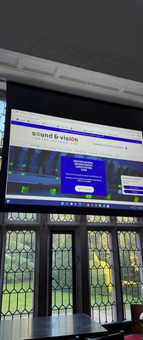 Website for Sound &amp; Vision Installations LTD displayed on a projector screen.