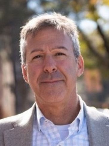 Portrait of a middle-aged man outdoors.