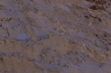 Rough rocky surface with some shadows.