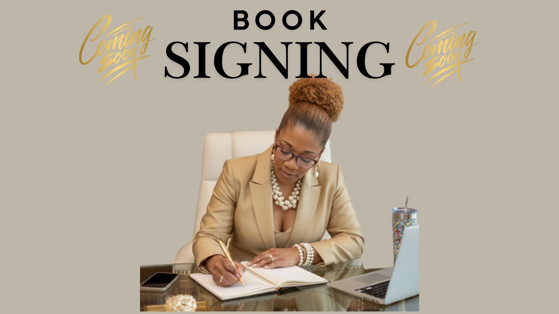 Woman signing a book at an upcoming book signing event.