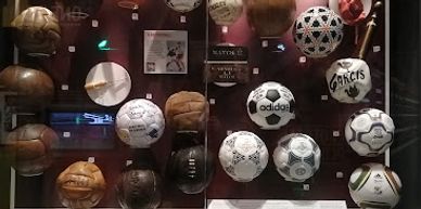 Footballs in a display cabinet