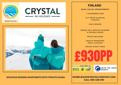 Couple in green ski jackets arm in arm looking at a ski slope