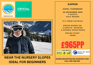 Skier standing on the slope with mountain in the background