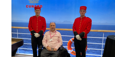Cunard bell boys with man in wheelchair and assistance dog 