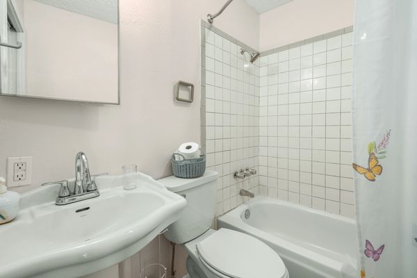Bathroom inside Studio 102 at Audrey's Place in Downtown Sebring FL hotel room, colorful Florida