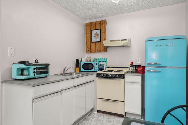 Full kitchen at Audrey's Place in Studio 102- a hotel room near Sebring International Raceway for ev