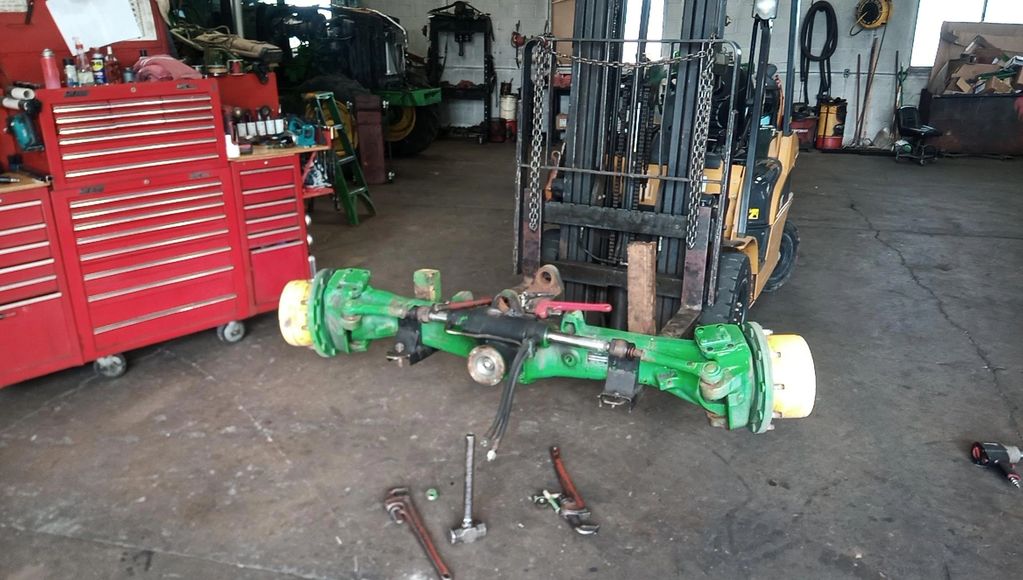 JD 7130 front axle, new ball joints, steering cylinder rebuild, knuckle bearings.