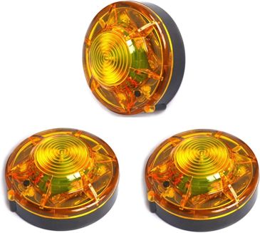 Three round amber LED lights with black bases.