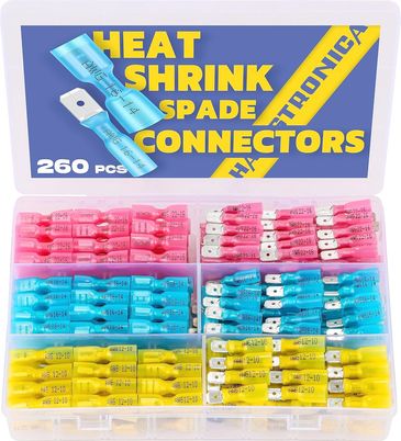 A colorful set of heat shrink spade connectors in a plastic organizer box.