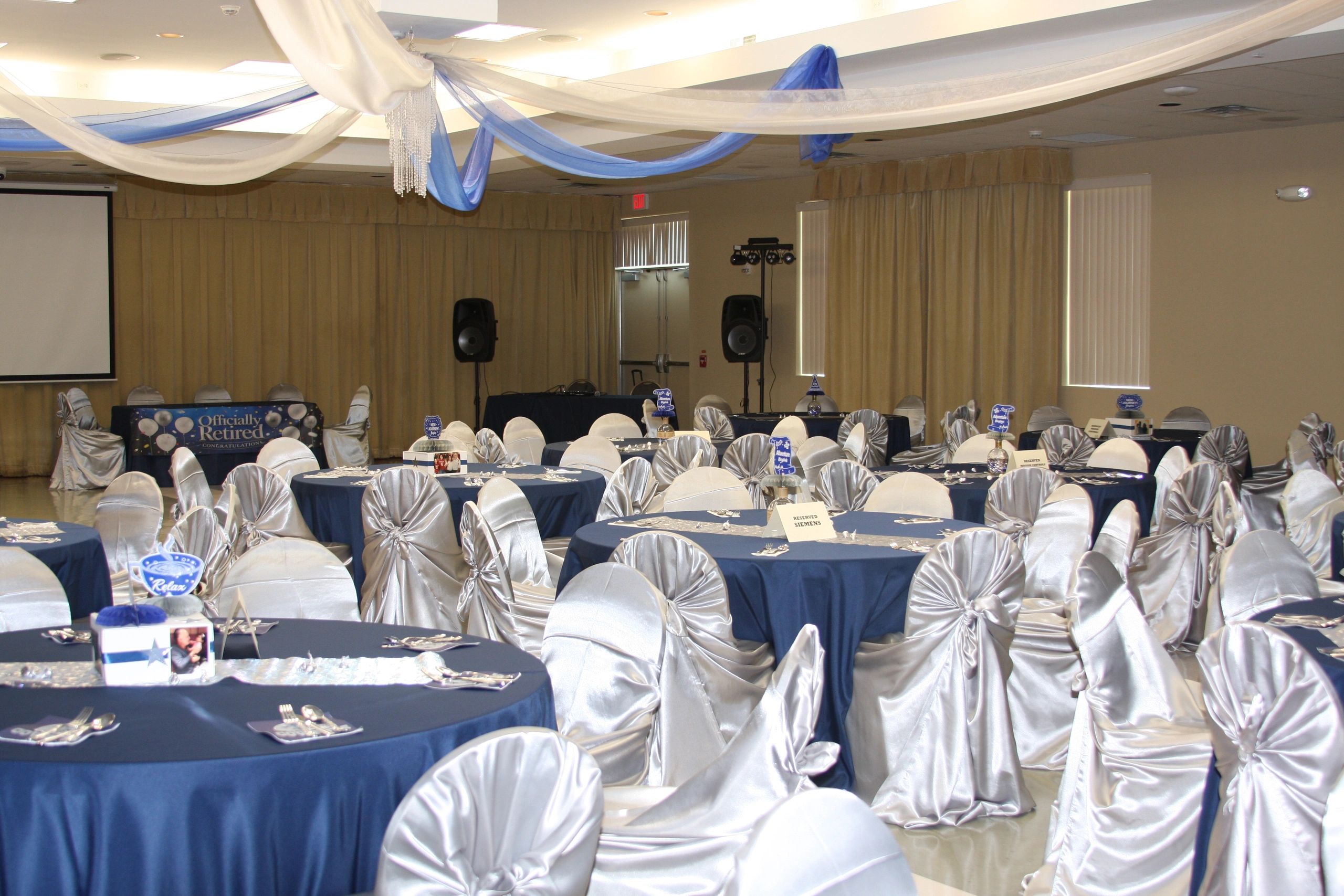 Decorated event hall for a retirement party.