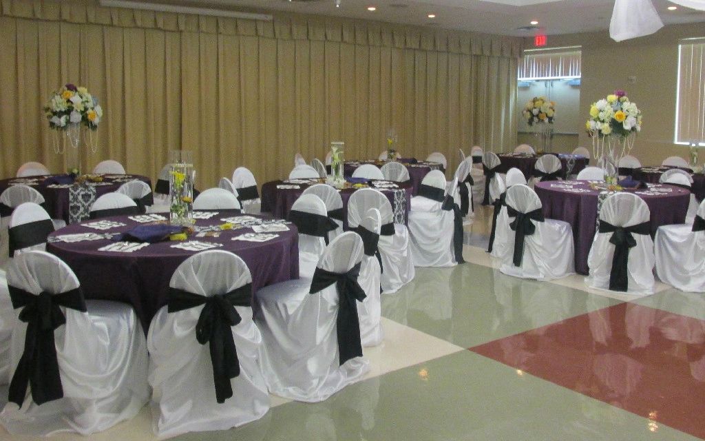 Eggplant satin linens and white satin self tie chair coves with a damask black and white runner.  I 