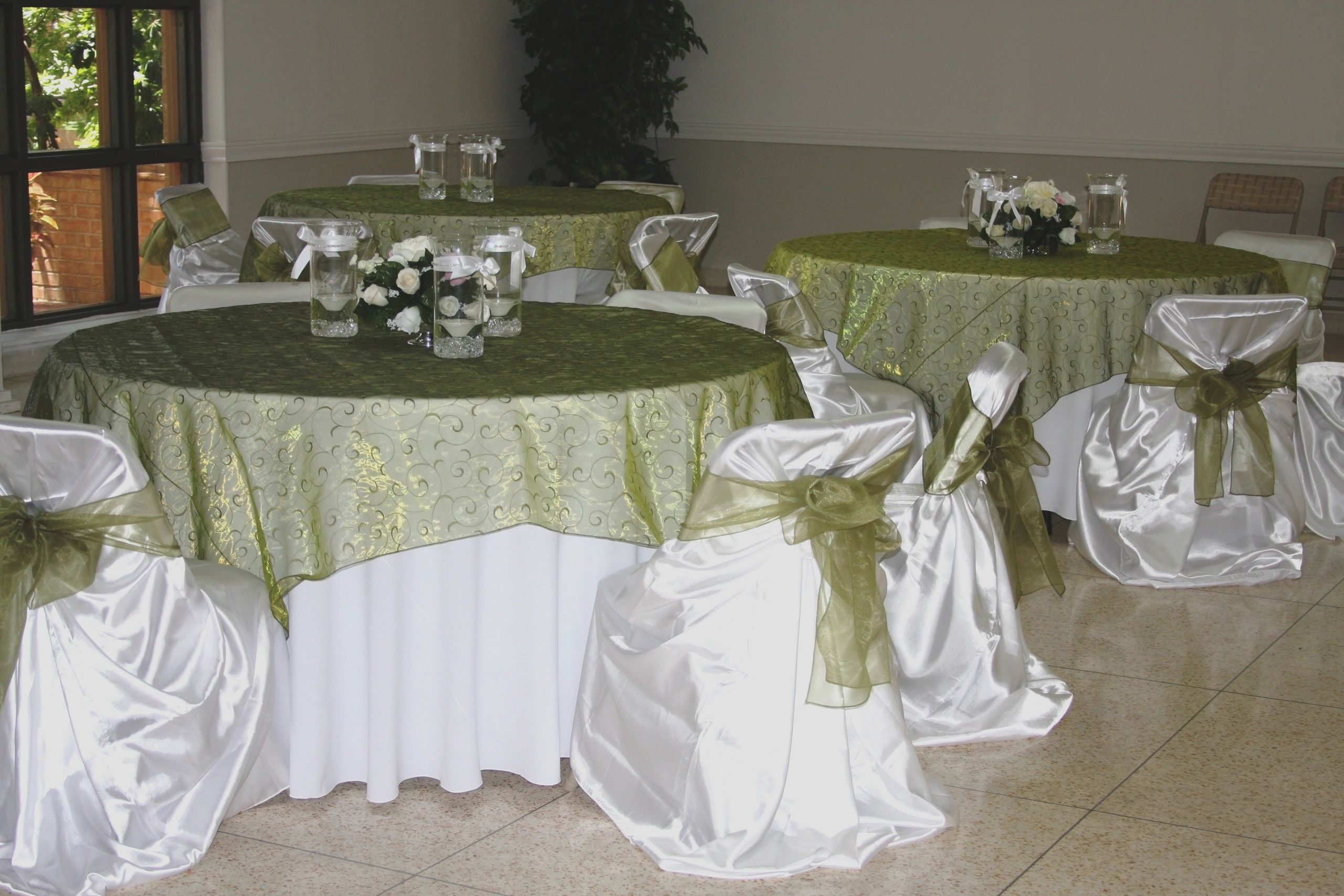 Sage green embroidered organza overlay matching color on sashes. 

