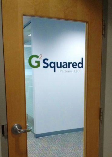 Office door with G2 Squared logo.