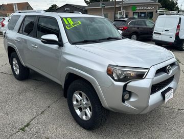Silver 2018 Toyota 4Runner parked in a lot for sale.