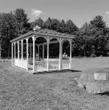 White gazebo in a park.