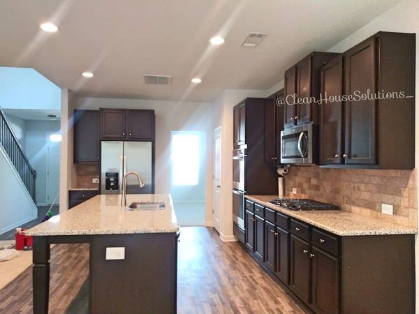 Kitchen cleaning. Move in and move out cleaning. Granite countertops. Dark kitchen cabinets & Island