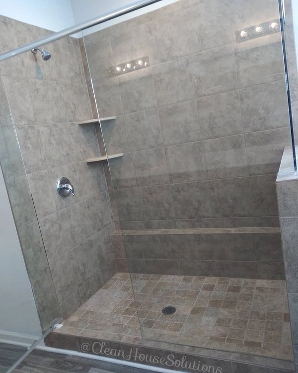 Clean Glass Shower. Stone shower. Updated modern shower and bathroom. Luxury shower. Sit down shower