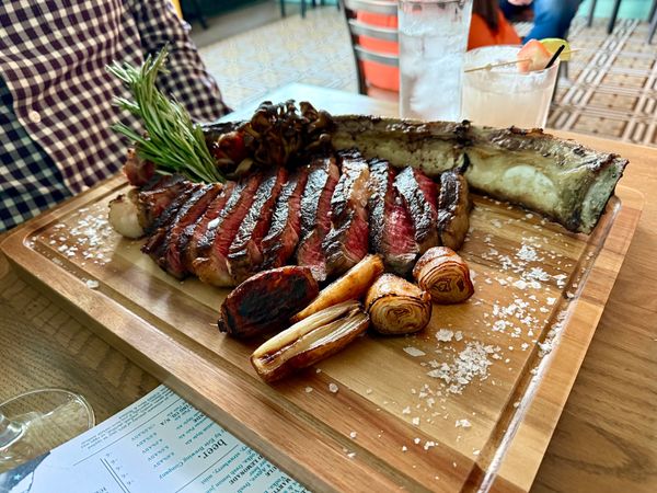 Tomahawk steak on cutting board