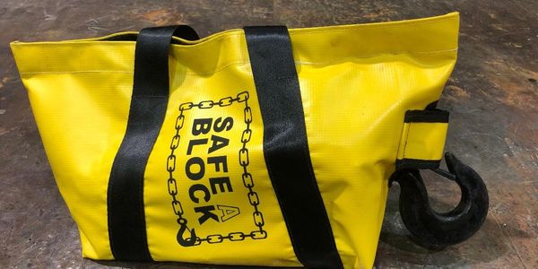 Chain block in Safe A Block bag. Keeping hooks and chains from dragging, catching, or causing a trip