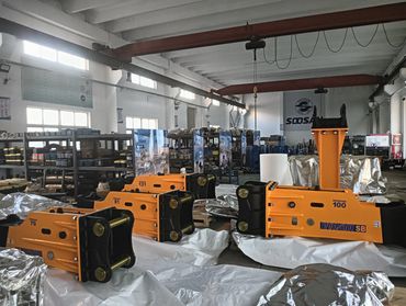 Soosan SB100 hydraulic breakers: robust mining tools on protective wrapping.