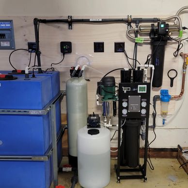 Water treatment system setup with tanks and filtration units.