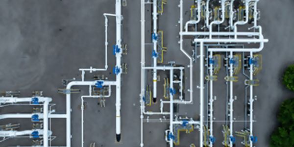 Aerial view of an industrial piping system with valves and connections.