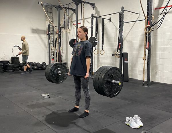 Female performing Deadlift