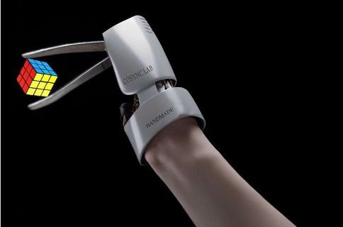 AI image representing prosthetic hand tweezers picking up a rubics cube.