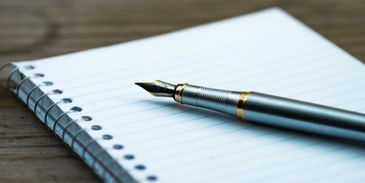 Pen and pad of paper