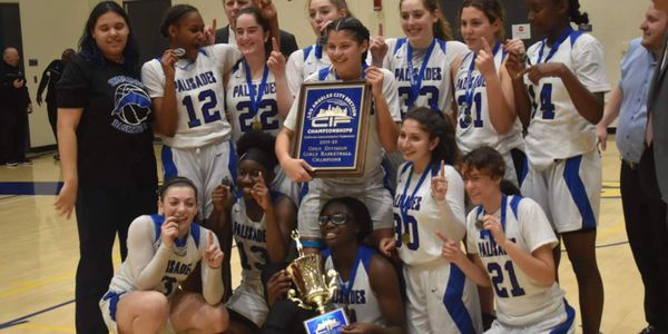 Image from Score Book Live article 
Alexis Pettis and her team (championship game) 